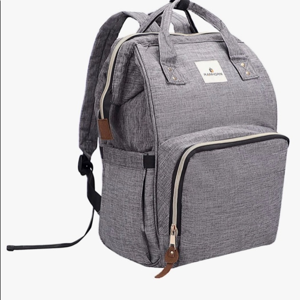 New in package gray diaper bag with pad - attaches to stroller ,holds bottles